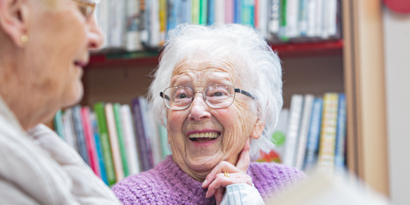 Lady over 60 in the library