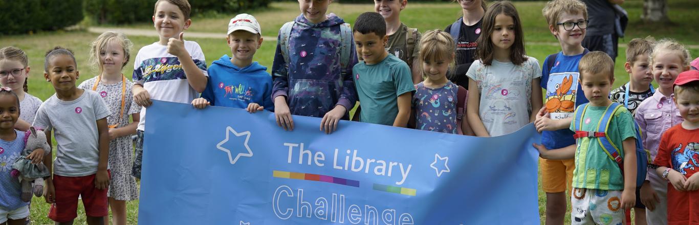 Children holding The Library Challenge banner